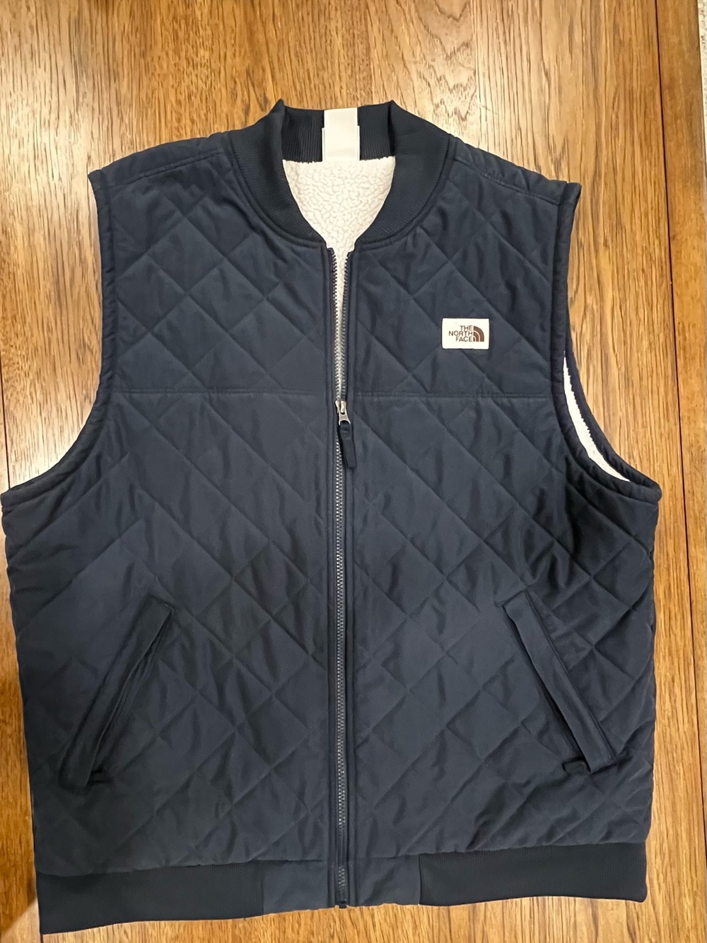 The North Face Men's Quilted Navy Blue Vest with Sherpa Lining